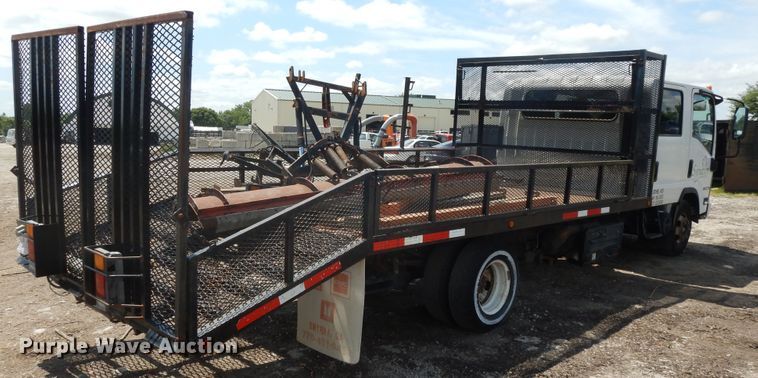 image for item DJ3474 2011 Isuzu NPR  flatbed truck