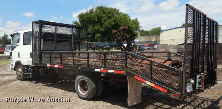 image for item DJ3474 2011 Isuzu NPR  flatbed truck