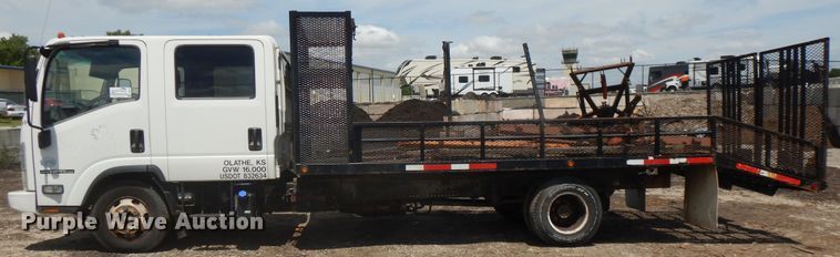 image for item DJ3474 2011 Isuzu NPR  flatbed truck