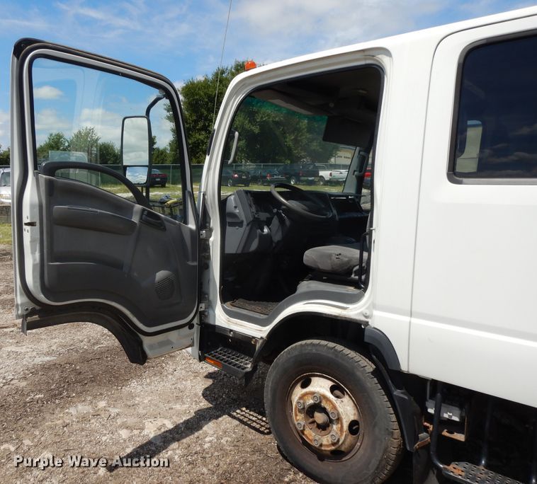 image for item DJ3474 2011 Isuzu NPR  flatbed truck