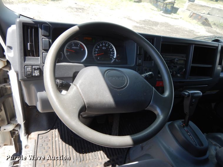 image for item DJ3474 2011 Isuzu NPR  flatbed truck