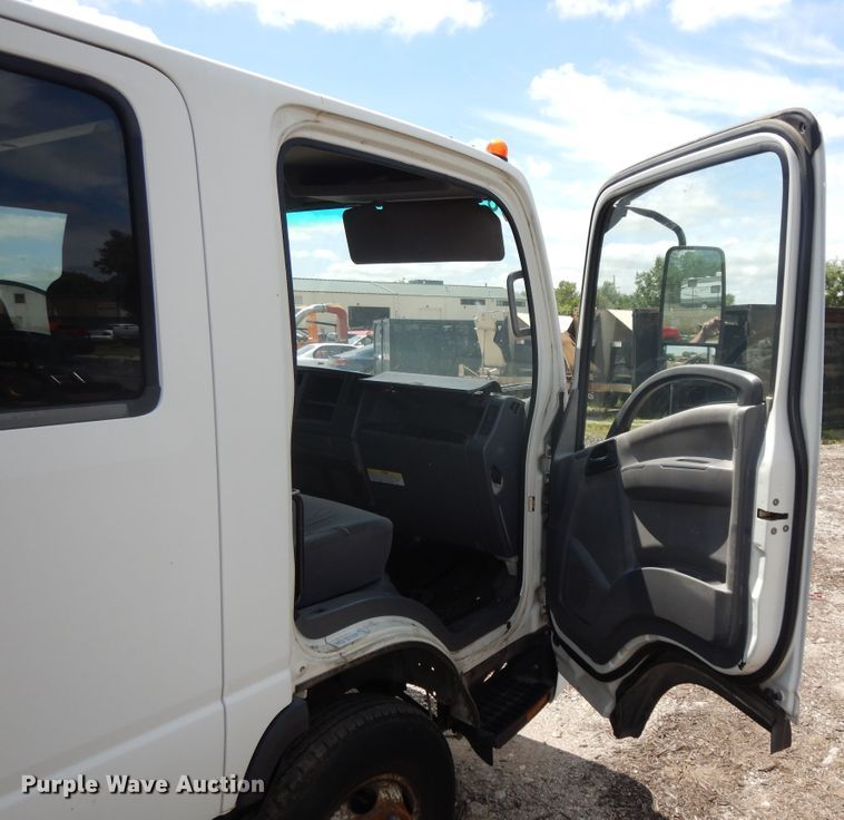 image for item DJ3474 2011 Isuzu NPR  flatbed truck