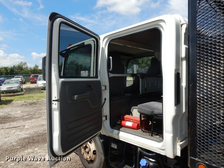 image for item DJ3474 2011 Isuzu NPR  flatbed truck