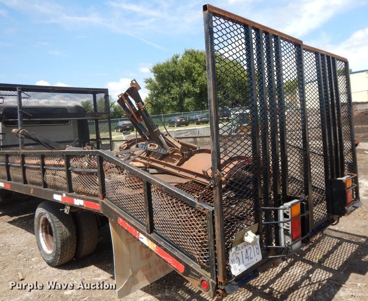 image for item DJ3474 2011 Isuzu NPR  flatbed truck