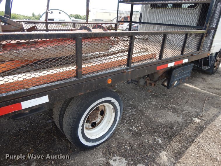 image for item DJ3474 2011 Isuzu NPR  flatbed truck