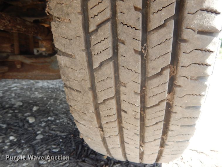 image for item DJ3474 2011 Isuzu NPR  flatbed truck