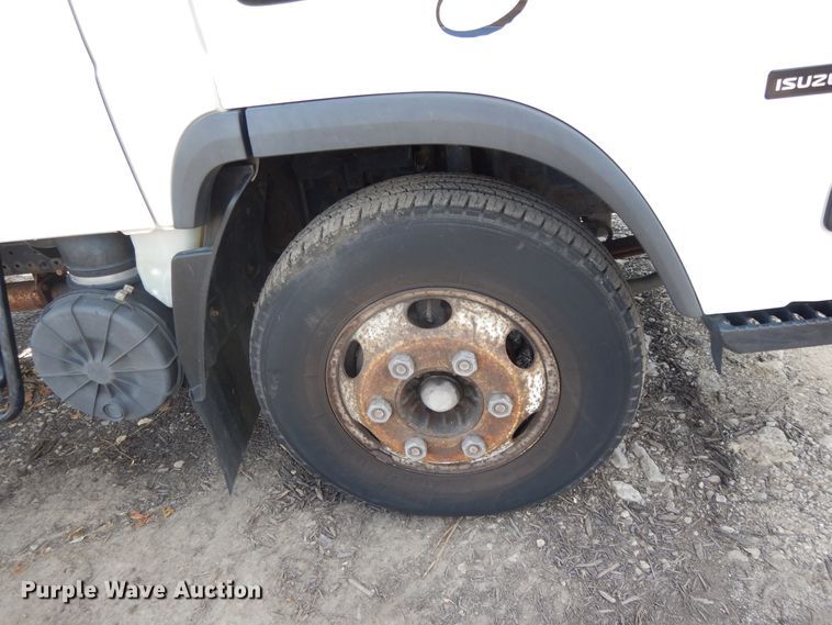 image for item DJ3474 2011 Isuzu NPR  flatbed truck