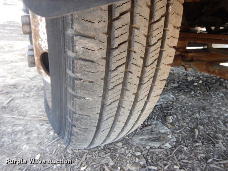 image for item DJ3474 2011 Isuzu NPR  flatbed truck