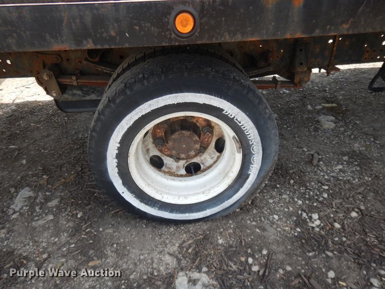 image for item DJ3474 2011 Isuzu NPR  flatbed truck