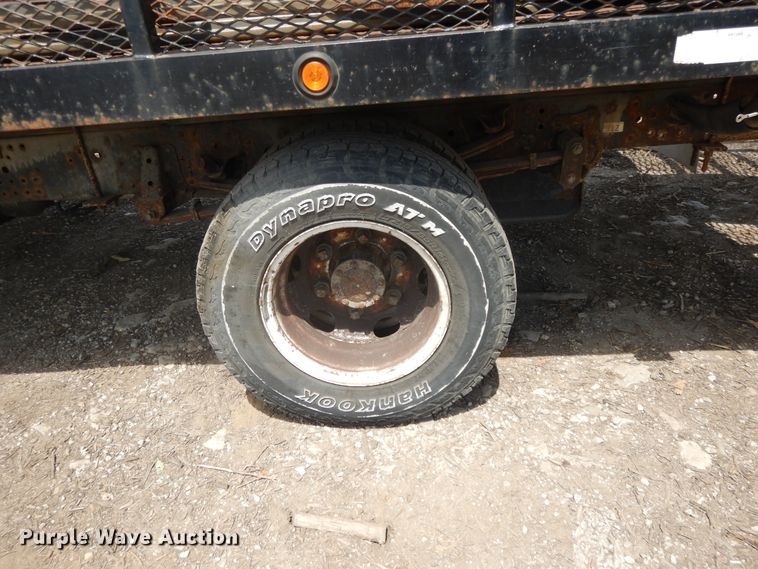 image for item DJ3474 2011 Isuzu NPR  flatbed truck