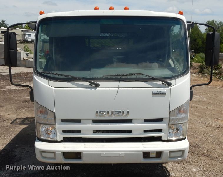 image for item DJ3476 2011 Isuzu NPR  flatbed truck