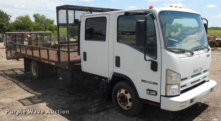 image for item DJ3476 2011 Isuzu NPR  flatbed truck