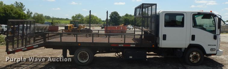 image for item DJ3476 2011 Isuzu NPR  flatbed truck