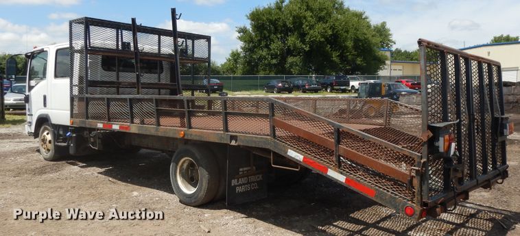 image for item DJ3476 2011 Isuzu NPR  flatbed truck