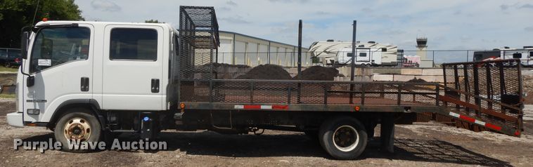 image for item DJ3476 2011 Isuzu NPR  flatbed truck