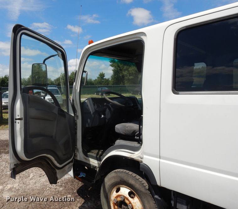 image for item DJ3476 2011 Isuzu NPR  flatbed truck