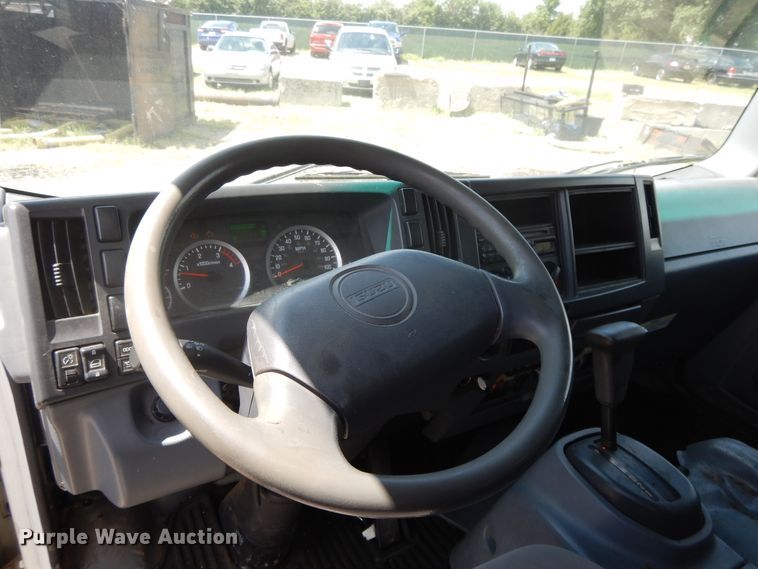 image for item DJ3476 2011 Isuzu NPR  flatbed truck