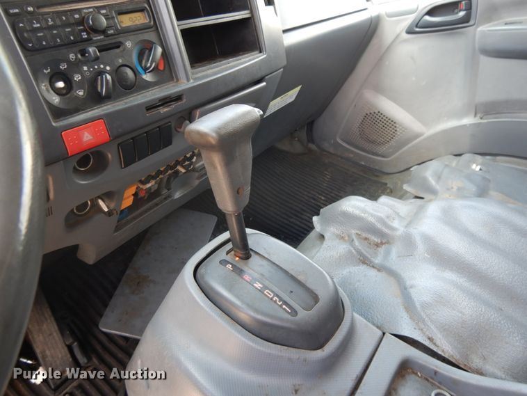 image for item DJ3476 2011 Isuzu NPR  flatbed truck