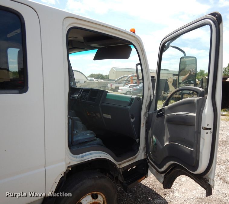 image for item DJ3476 2011 Isuzu NPR  flatbed truck