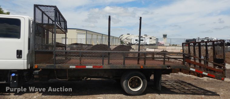 image for item DJ3476 2011 Isuzu NPR  flatbed truck