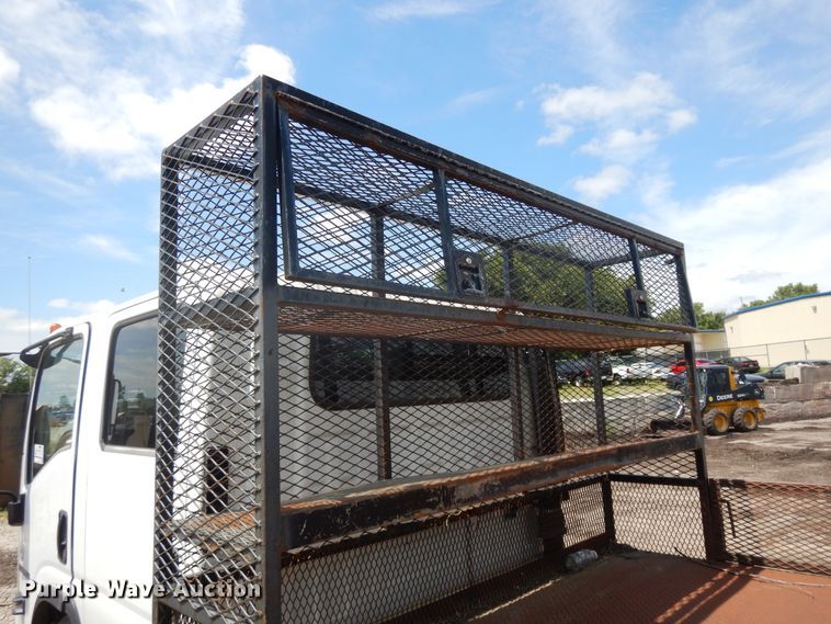 image for item DJ3476 2011 Isuzu NPR  flatbed truck