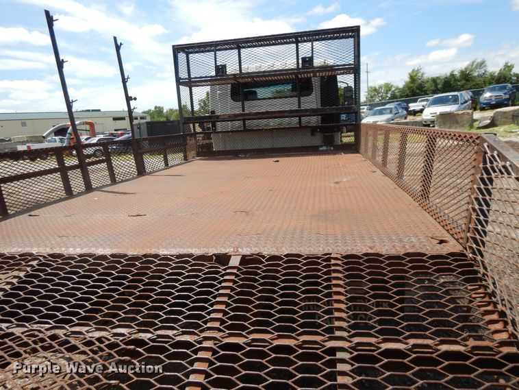 image for item DJ3476 2011 Isuzu NPR  flatbed truck