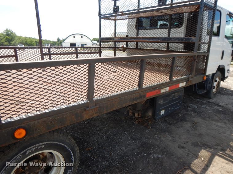 image for item DJ3476 2011 Isuzu NPR  flatbed truck