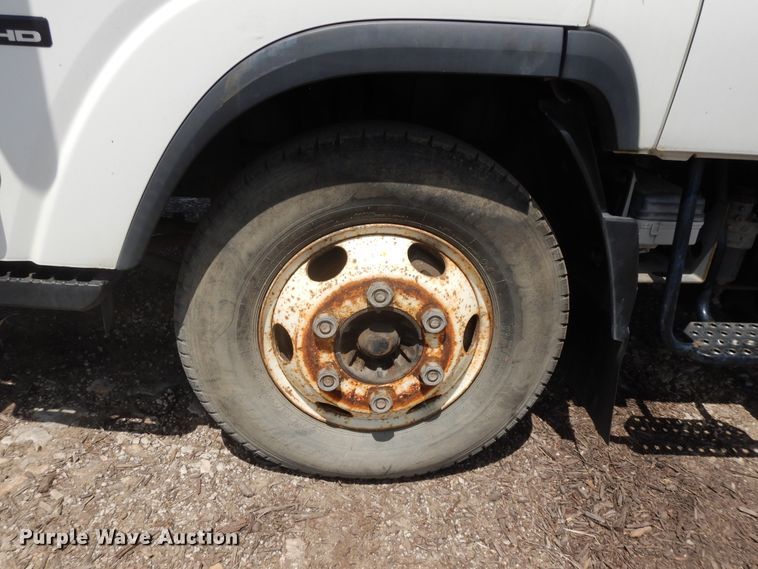 image for item DJ3476 2011 Isuzu NPR  flatbed truck