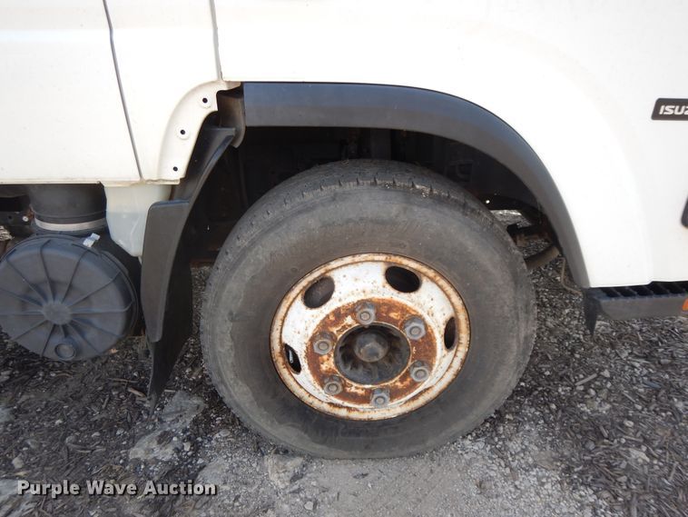 image for item DJ3476 2011 Isuzu NPR  flatbed truck