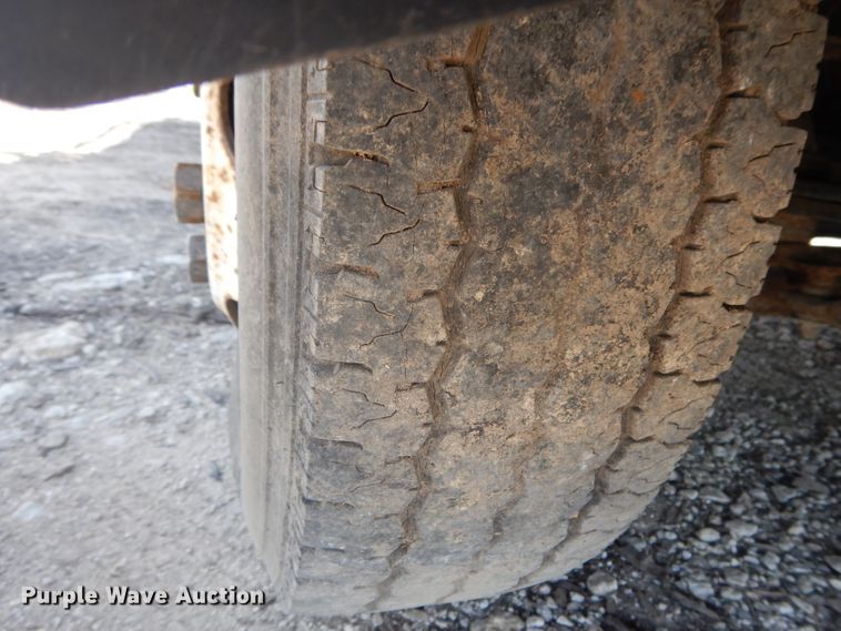 image for item DJ3476 2011 Isuzu NPR  flatbed truck