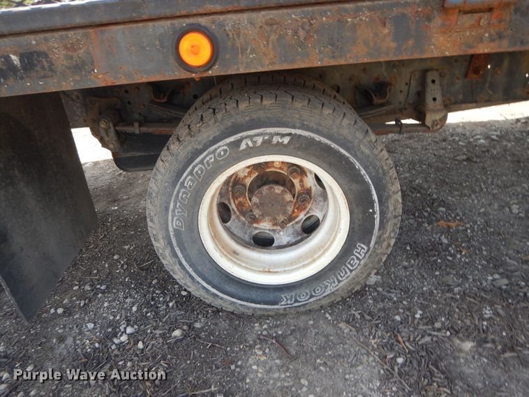 image for item DJ3476 2011 Isuzu NPR  flatbed truck