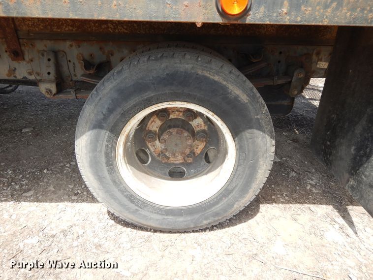 image for item DJ3476 2011 Isuzu NPR  flatbed truck