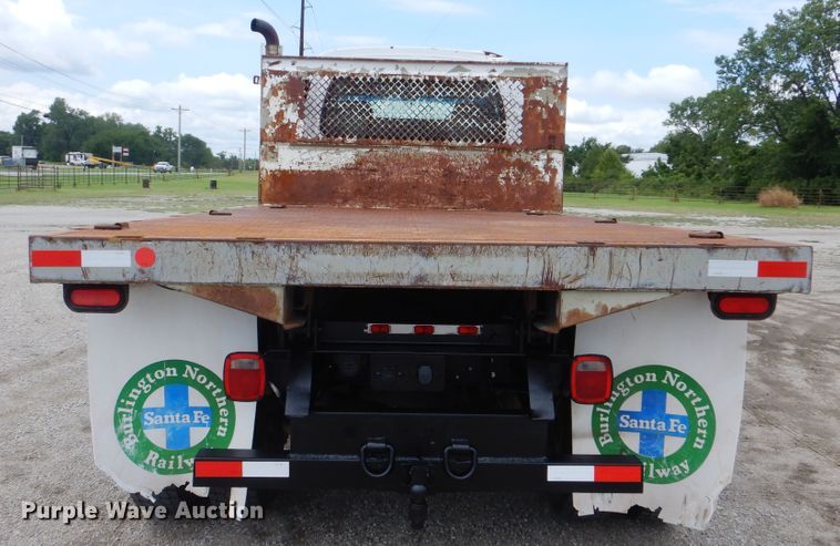 image for item GM9106 2004 GMC C7500  Crew Cab flat dump bed truck