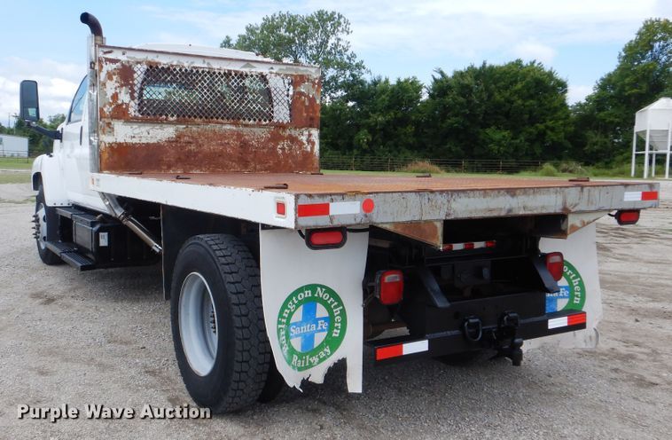 image for item GM9106 2004 GMC C7500  Crew Cab flat dump bed truck