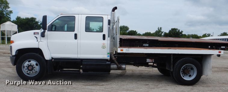 image for item GM9106 2004 GMC C7500  Crew Cab flat dump bed truck