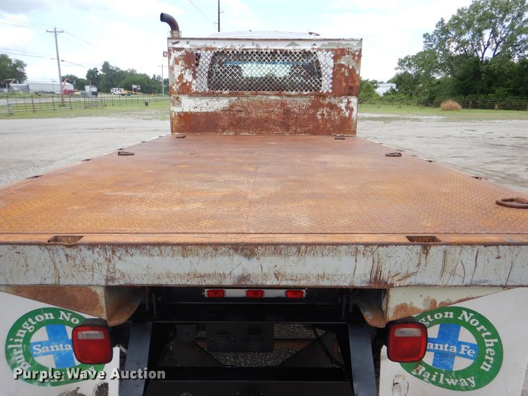 image for item GM9106 2004 GMC C7500  Crew Cab flat dump bed truck