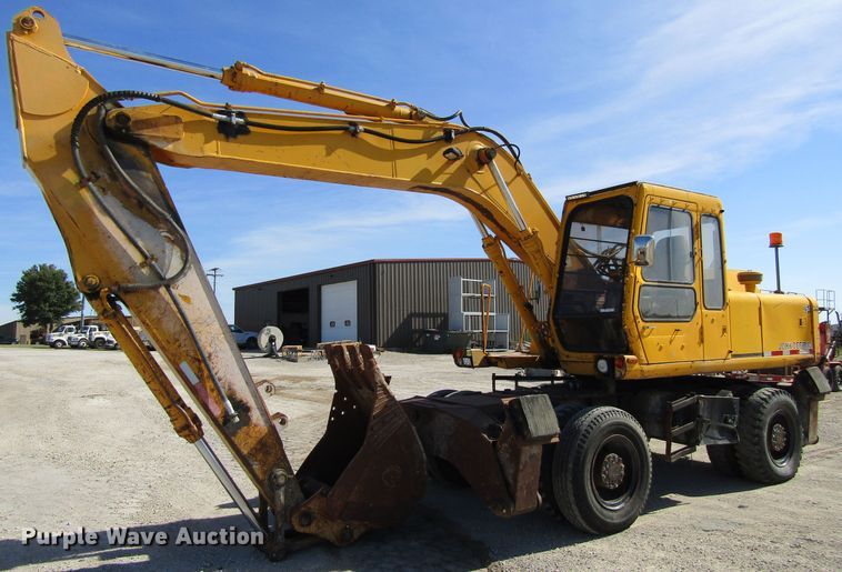 image for item GQ9085 1994 John Deere 595D  rubber tire excavator