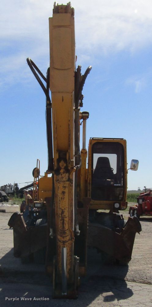 image for item GQ9085 1994 John Deere 595D  rubber tire excavator