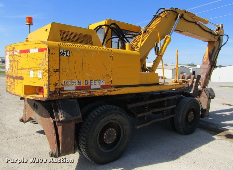 image for item GQ9085 1994 John Deere 595D  rubber tire excavator