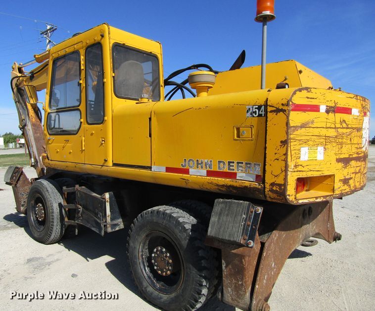 image for item GQ9085 1994 John Deere 595D  rubber tire excavator