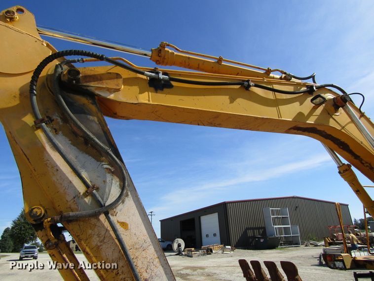 image for item GQ9085 1994 John Deere 595D  rubber tire excavator