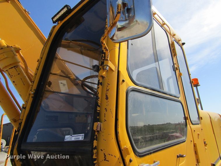 image for item GQ9085 1994 John Deere 595D  rubber tire excavator