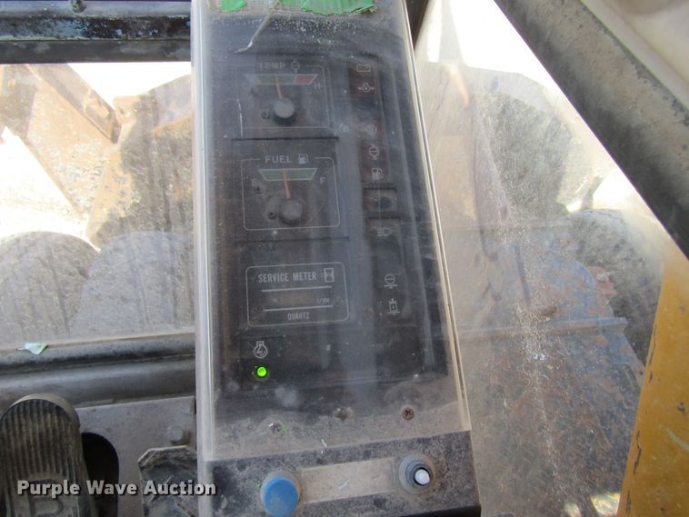 image for item GQ9085 1994 John Deere 595D  rubber tire excavator