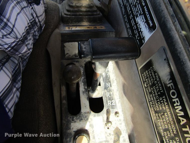 image for item GQ9085 1994 John Deere 595D  rubber tire excavator