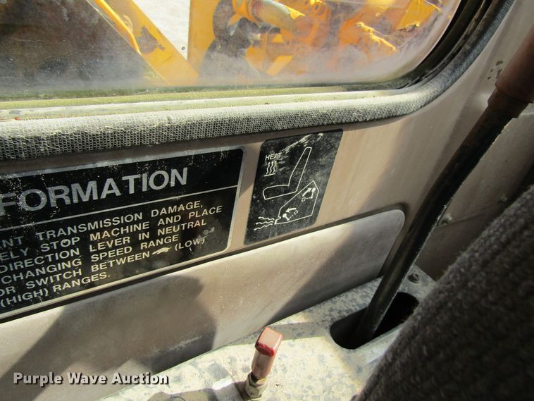 image for item GQ9085 1994 John Deere 595D  rubber tire excavator