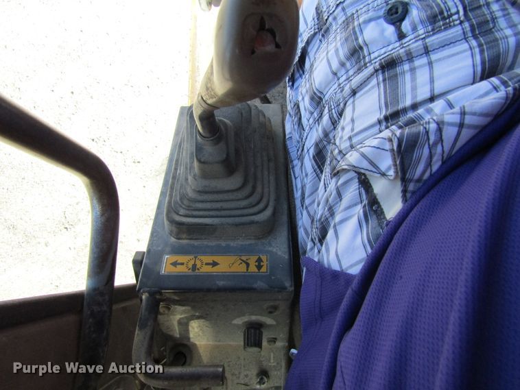 image for item GQ9085 1994 John Deere 595D  rubber tire excavator