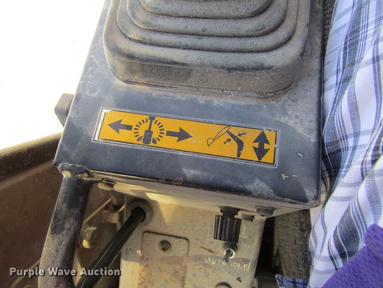 image for item GQ9085 1994 John Deere 595D  rubber tire excavator