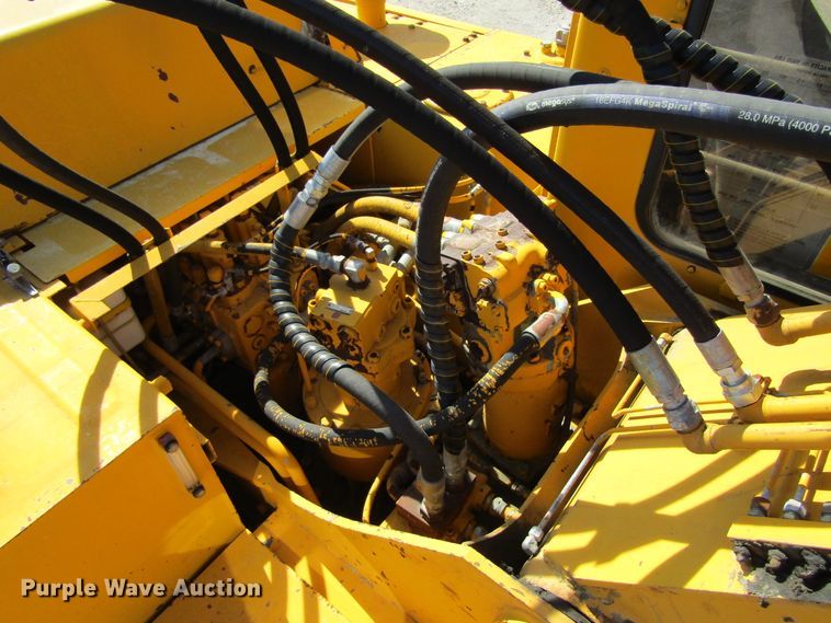 image for item GQ9085 1994 John Deere 595D  rubber tire excavator