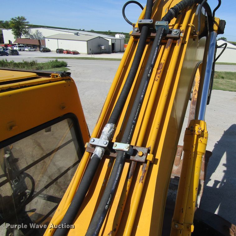 image for item GQ9085 1994 John Deere 595D  rubber tire excavator