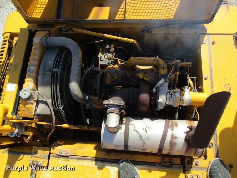 image for item GQ9085 1994 John Deere 595D  rubber tire excavator